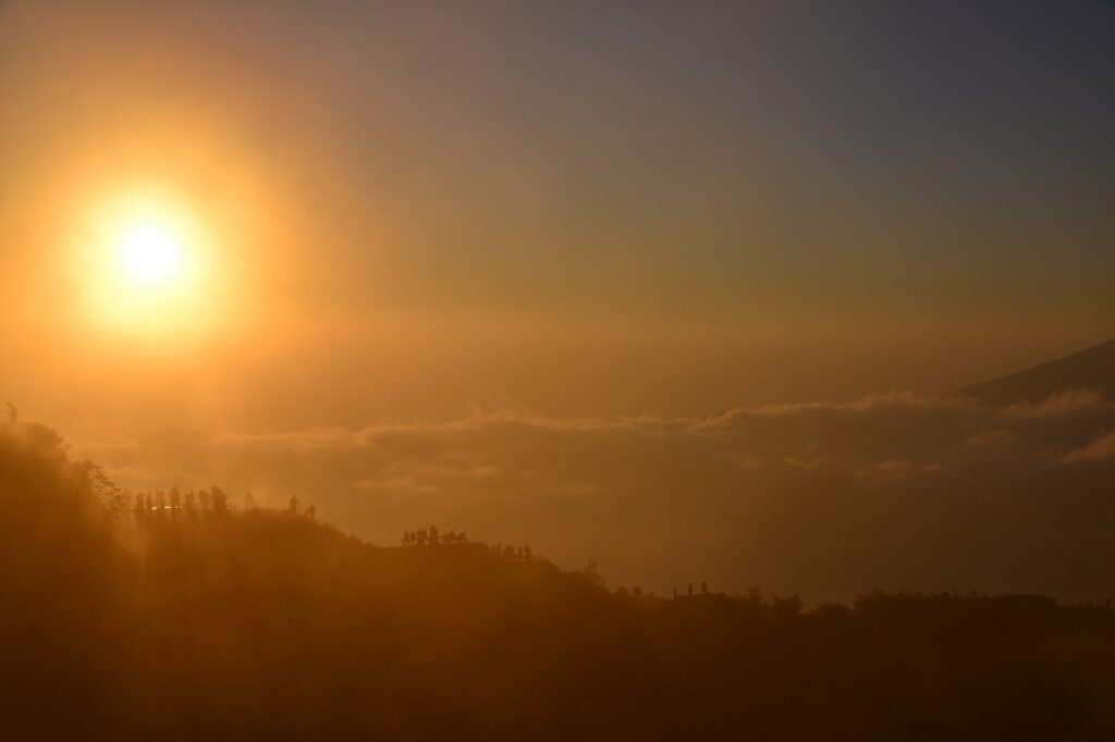 Sunrise above the clouds near Mount Batur in Bali