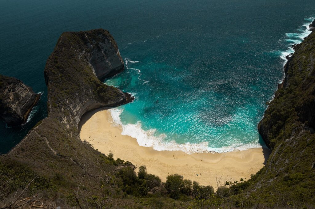 Rocky coastline and blue sea on Nusa Penida, Bali