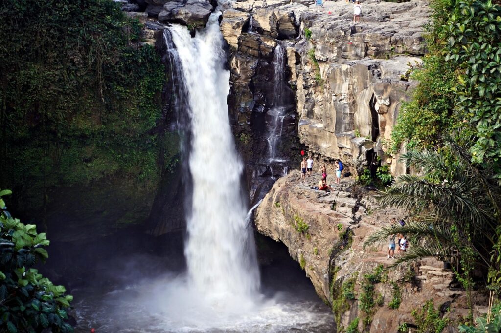 Tegenungan Waterfall surrounded by green vegetation in Bali